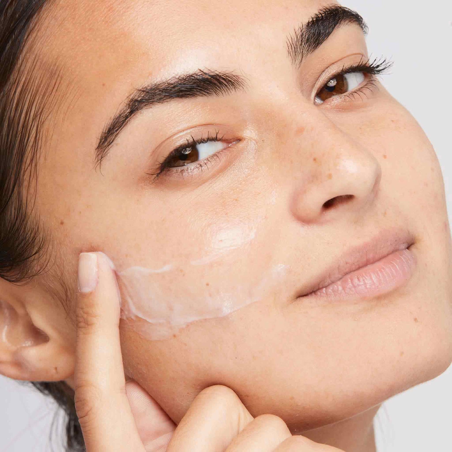 woman applying active moist